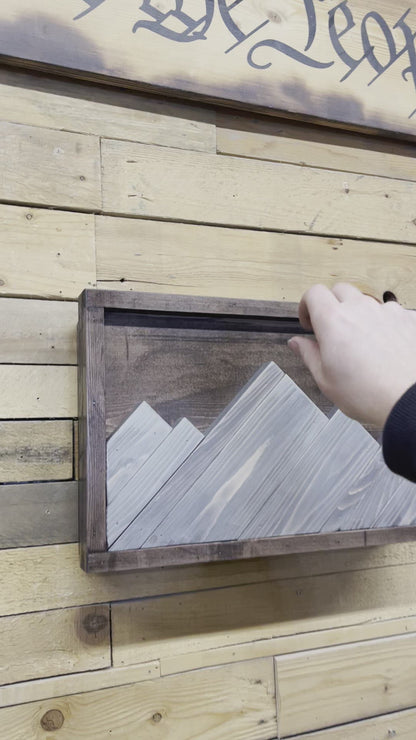 Mountain hidden gun decor